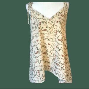 BOUTIQUE ITEM- FLORAL CREAM TANK TOP WITH SHARK BITE HEM